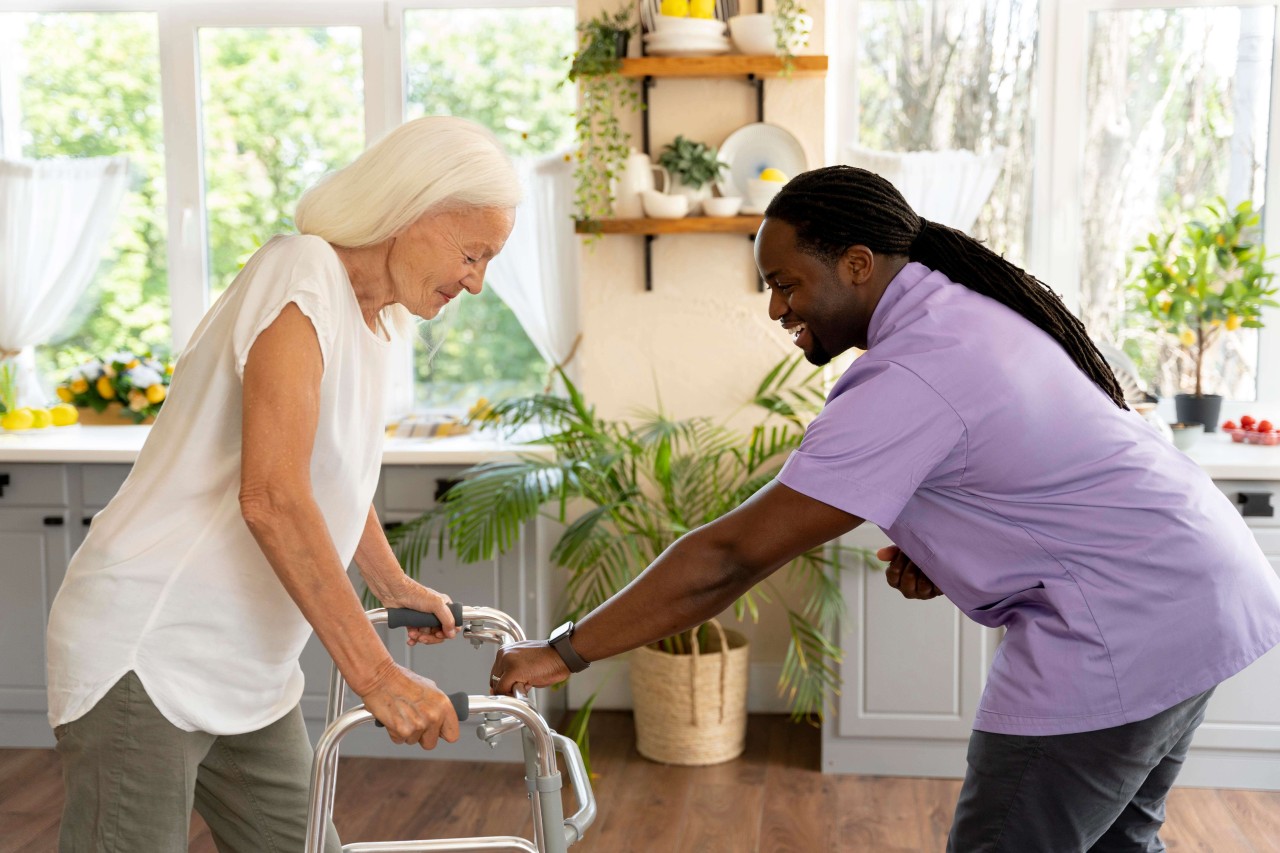 male-social-worker-taking-care-old-woman-1
